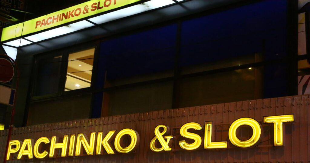 パチンコ店のネオンサインと引き寄せの法則をテーマにした導入画像